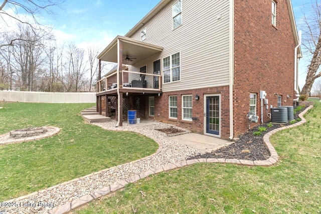 135 N Parkside Dr, Bardstown, KY 40004 - rear view of house featuring a ceiling fan, brick siding, a deck, a patio, and central AC
