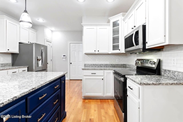 135 N Parkside Dr, Bardstown, KY 40004 - kitchen with appliances with stainless steel finishes, blue cabinets, white cabinetry, backsplash, and recessed lighting