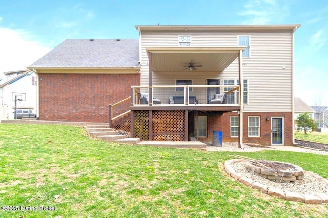 135 N Parkside Dr, Bardstown, KY 40004 - back of property with a ceiling fan, a fire pit, brick siding, and a yard