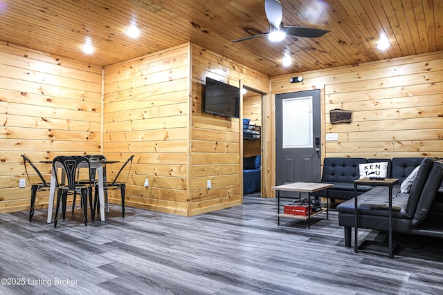 11835 Peonia Rd, Clarkson, KY 42726 - living area featuring a ceiling fan, wood finished floors, wooden ceiling, and wood walls