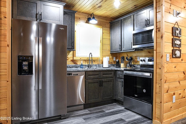 11835 Peonia Rd, Clarkson, KY 42726 - kitchen with stainless steel appliances, a sink, dark wood-type flooring, wood ceiling, and dark stone countertops