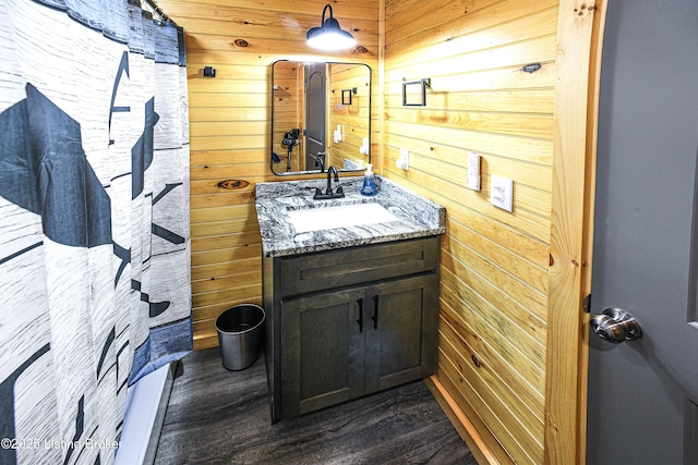 11835 Peonia Rd, Clarkson, KY 42726 - bathroom with wooden walls, wood finished floors, and vanity