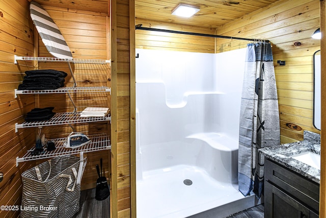 11835 Peonia Rd, Clarkson, KY 42726 - full bathroom with wooden walls, a stall shower, wood ceiling, and vanity