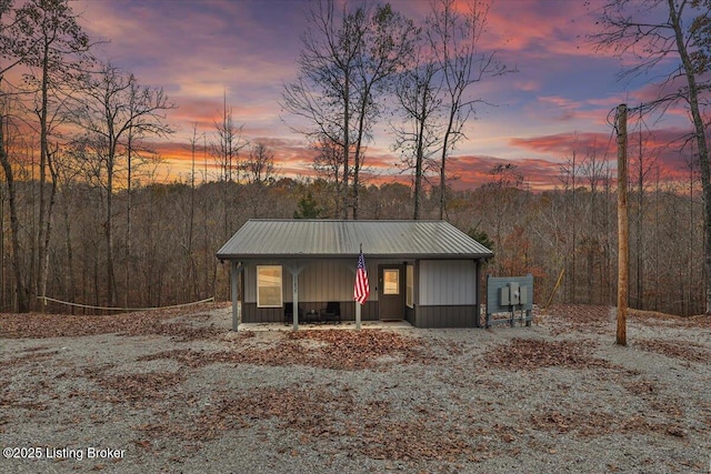 11835 Peonia Rd, Clarkson, KY 42726 - view of front of property featuring metal roof and a wooded view