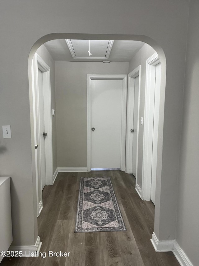 4908 Hillview Dr, Louisville, KY 40258 - corridor featuring attic access, wood finished floors, and baseboards