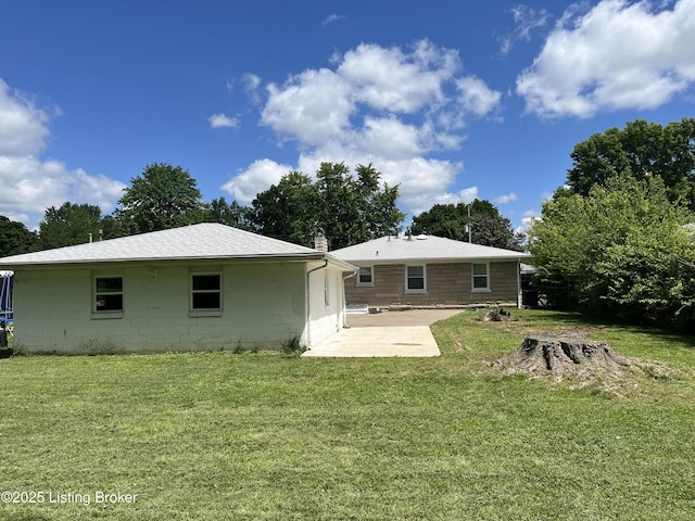4908 Hillview Dr, Louisville, KY 40258 - rear view of property with a patio, a lawn, and concrete block siding