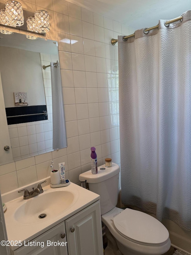 4908 Hillview Dr, Louisville, KY 40258 - bathroom featuring decorative backsplash, vanity, toilet, curtained shower, and tile walls