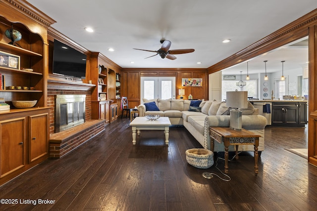 700 Sentry Way, Louisville, KY 40223 - living room with a ceiling fan, a fireplace, ornamental molding, dark wood finished floors, and recessed lighting