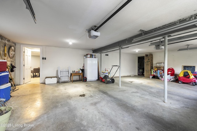 700 Sentry Way, Louisville, KY 40223 - garage featuring a garage door opener and refrigerator
