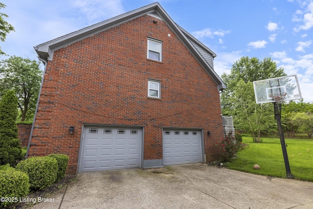 700 Sentry Way, Louisville, KY 40223 - view of home's exterior featuring a garage, concrete driveway, a yard, and brick siding