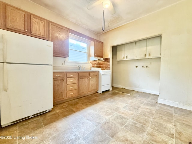 1428 Shingo Ave, Louisville, KY 40215 - kitchen featuring freestanding refrigerator, a ceiling fan, stove, light countertops, and under cabinet range hood