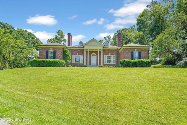 1802 Park Boundary Rd, Louisville, KY 40205 - greek revival house with a chimney, a front lawn, and brick siding