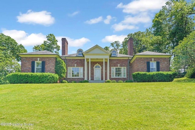 1802 Park Boundary Rd, Louisville, KY 40205 - neoclassical home featuring a chimney, a front yard, and brick siding