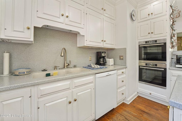 1802 Park Boundary Rd, Louisville, KY 40205 - kitchen featuring dishwasher, a sink, light countertops, double oven, and white cabinets