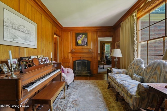 1802 Park Boundary Rd, Louisville, KY 40205 - sitting room with a fireplace, wooden walls, wood finished floors, and crown molding