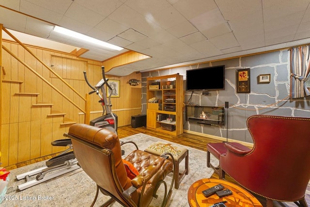 1802 Park Boundary Rd, Louisville, KY 40205 - living room featuring stairs, wooden walls, and wood finished floors