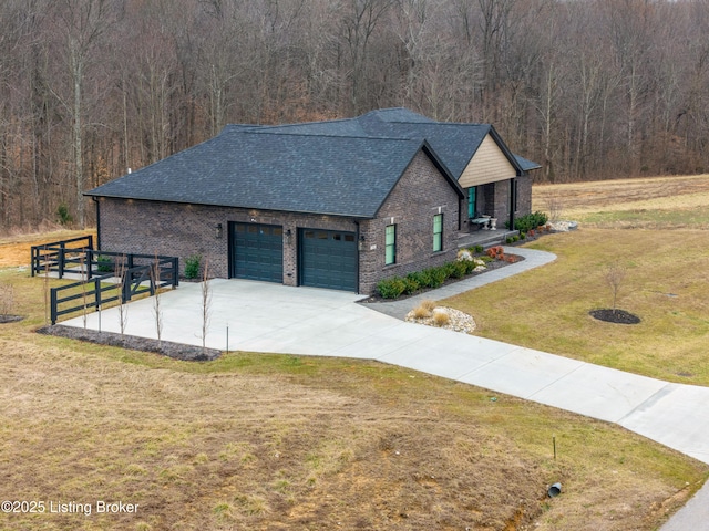 190 Foxwood Ct, Elizabethtown, KY 42701 - view of front of property with an attached garage, brick siding, a shingled roof, and a forest view