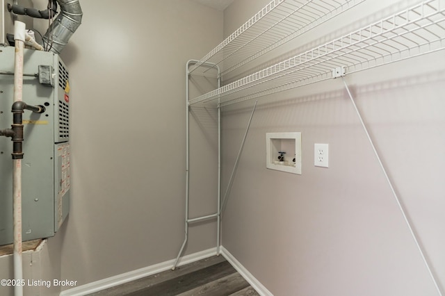 6713 Fenske Ln, Louisville, KY 40258 - washroom featuring hookup for a washing machine, wood finished floors, baseboards, and heating unit
