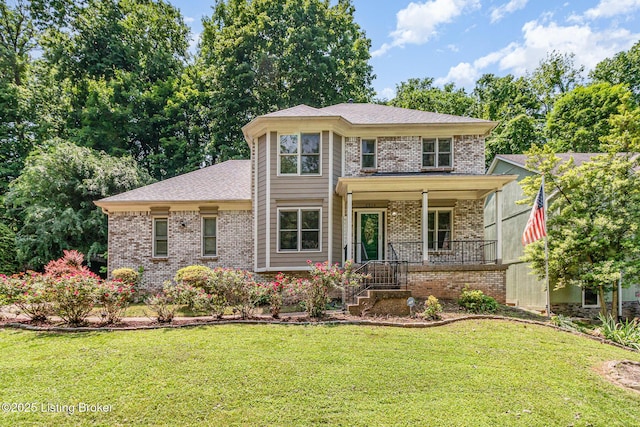 2516 Phoenix Hill Dr, Louisville, KY 40207 - view of front of house with brick siding, covered porch, and a front yard