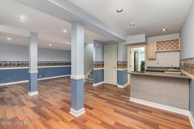 2516 Phoenix Hill Dr, Louisville, KY 40207 - kitchen featuring decorative backsplash, wood finished floors, a sink, baseboards, and recessed lighting