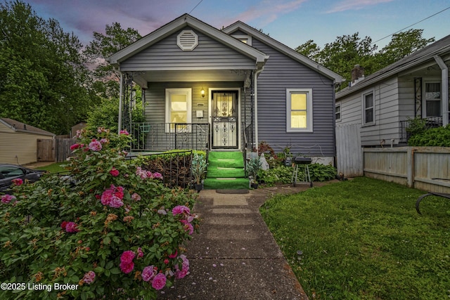 1412 Haskin Ave, Louisville, KY 40215 - shotgun-style home with a porch