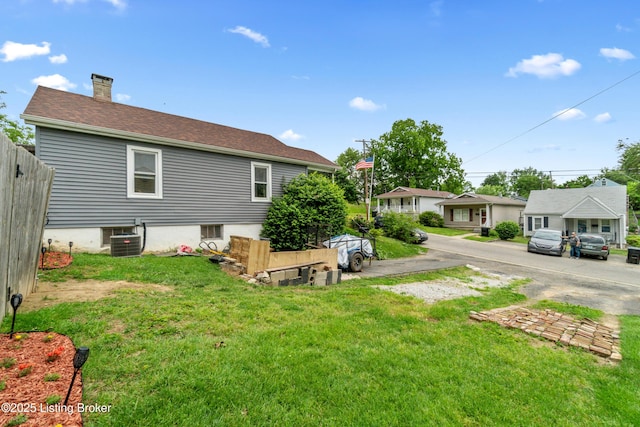 1412 Haskin Ave, Louisville, KY 40215 - rear view of house with central AC and a chimney
