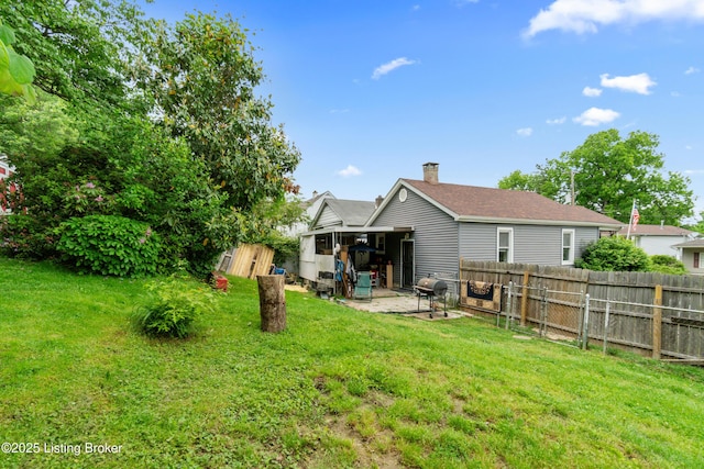 1412 Haskin Ave, Louisville, KY 40215 - rear view of property with a storage unit, an outdoor structure, a patio, and a chimney