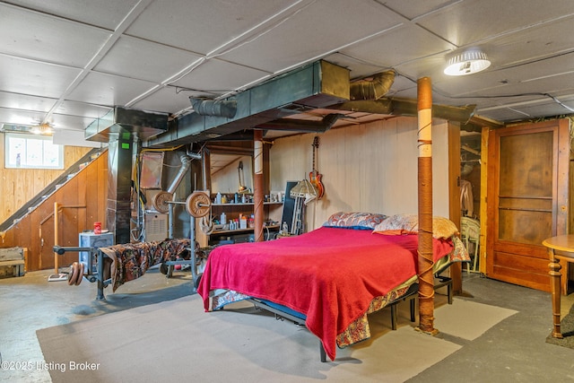 1412 Haskin Ave, Louisville, KY 40215 - bedroom featuring wooden walls and concrete flooring