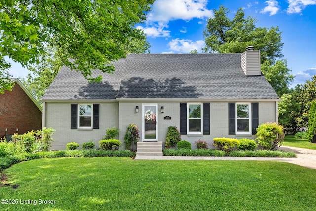 118 Guthrie Dr, Bardstown, KY 40004 - cape cod-style house featuring a front lawn, a chimney, brick siding, and roof with shingles