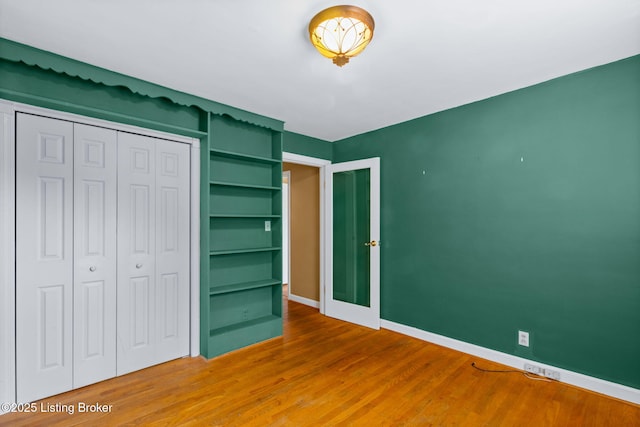 118 Guthrie Dr, Bardstown, KY 40004 - unfurnished bedroom featuring baseboards, wood finished floors, and a closet