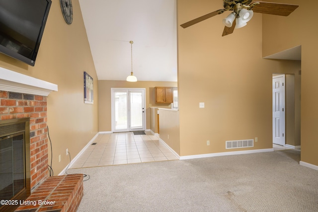 9901 Park Lake Cir, Louisville, KY 40229 - unfurnished living room with high vaulted ceiling, light carpet, a brick fireplace, baseboards, and ceiling fan