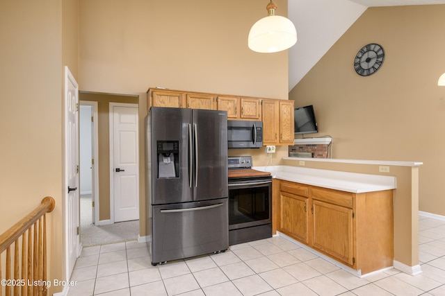 9901 Park Lake Cir, Louisville, KY 40229 - kitchen with stainless steel appliances, high vaulted ceiling, a peninsula, light countertops, and light tile patterned floors