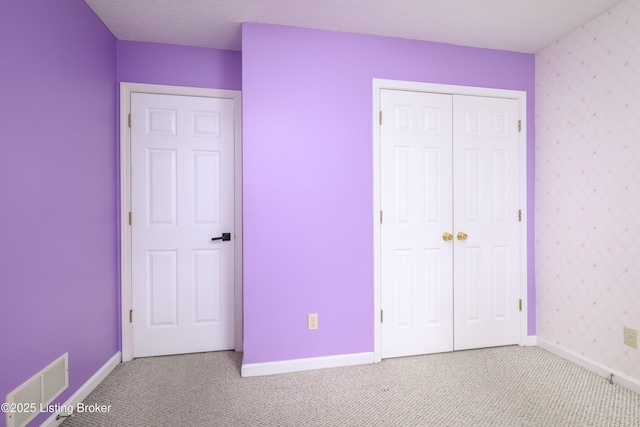 9901 Park Lake Cir, Louisville, KY 40229 - unfurnished bedroom with carpet floors, baseboards, and a closet