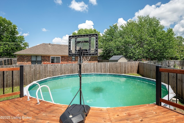 9901 Park Lake Cir, Louisville, KY 40229 - view of pool with a wooden deck and a fenced backyard