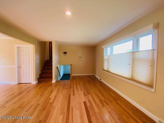 606 Nally Ct, Bardstown, KY 40004 - unfurnished living room featuring baseboards, light wood finished floors, stairway, and recessed lighting