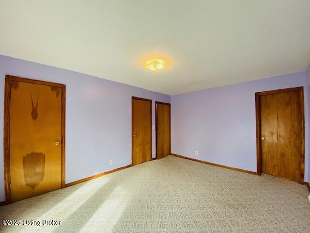 606 Nally Ct, Bardstown, KY 40004 - unfurnished bedroom featuring baseboards and light colored carpet