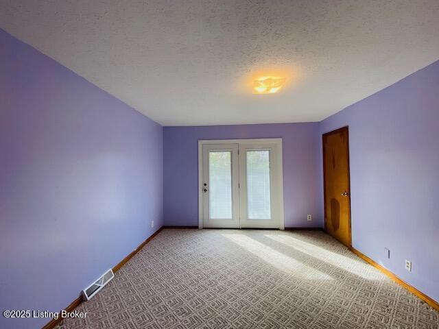 606 Nally Ct, Bardstown, KY 40004 - unfurnished room featuring baseboards, light carpet, and a textured ceiling