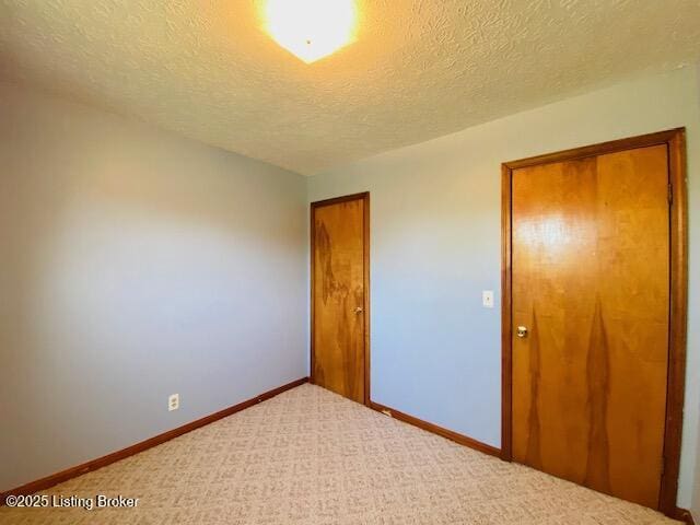 606 Nally Ct, Bardstown, KY 40004 - unfurnished room featuring a textured ceiling, carpet floors, and baseboards