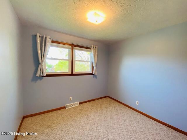 606 Nally Ct, Bardstown, KY 40004 - unfurnished room featuring a textured ceiling, light carpet, and baseboards