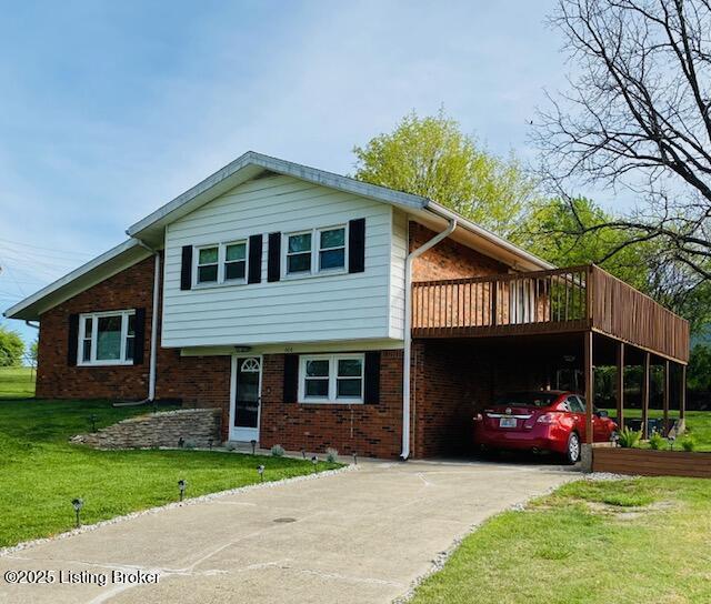 606 Nally Ct, Bardstown, KY 40004 - tri-level home with concrete driveway, a front yard, and brick siding