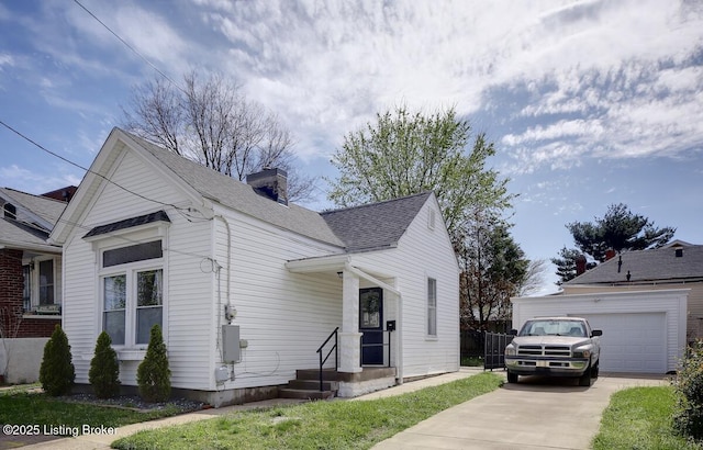 1517 Hoertz Ave, Louisville, KY 40217 - view of front of home with a garage, a chimney, roof with shingles, and concrete driveway