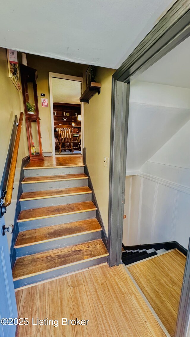 1239 Schiller Ave, Louisville, KY 40204 - stairway featuring wood finished floors