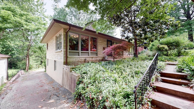 5303 Park Rd, Louisville, KY 40214 - view of front facade featuring stone siding and a chimney