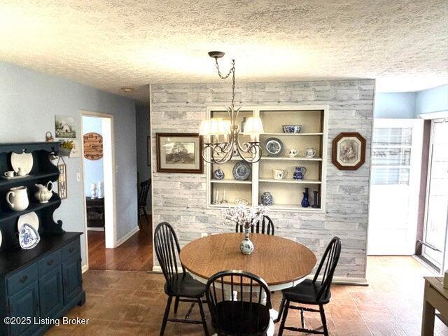 113 Madison Ave, Bardstown, KY 40004 - dining space featuring plenty of natural light, a chandelier, a textured ceiling, and built in features
