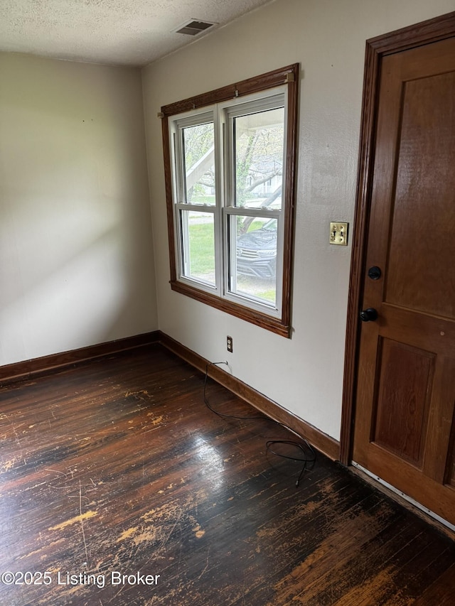 1614 Washington Blvd, Lyndon, KY 40242 - unfurnished room with dark wood-style flooring, baseboards, and a textured ceiling