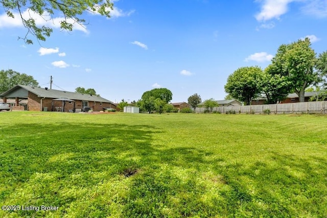 view of yard featuring fence