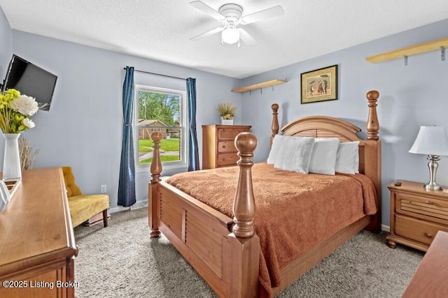 bedroom with light carpet, ceiling fan, and baseboards
