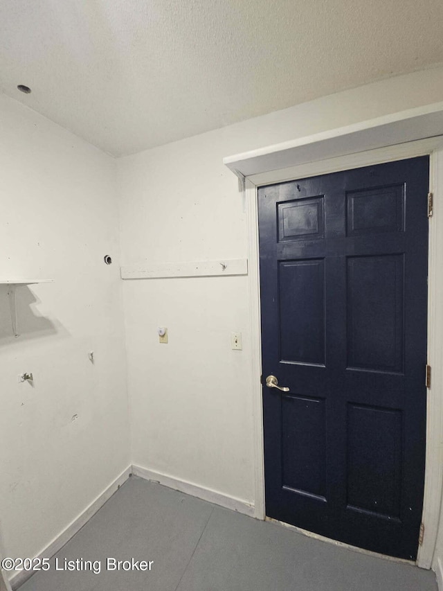 143 Irvin Ct, Radcliff, KY 40160 - washroom featuring baseboards and a textured ceiling