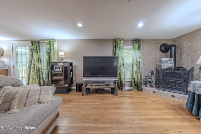 3085 Centerview Rough River Ln, Hudson, KY 40145 - living room with wood finished floors, a wood stove, recessed lighting, and plenty of natural light
