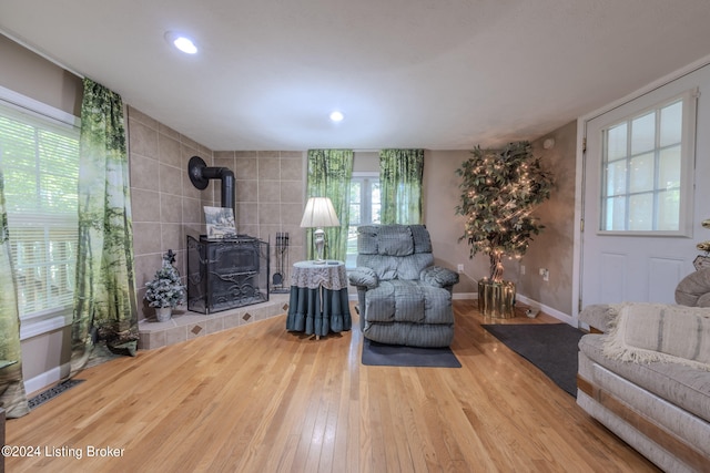 3085 Centerview Rough River Ln, Hudson, KY 40145 - living area featuring wood finished floors, a wood stove, healthy amount of natural light, and recessed lighting
